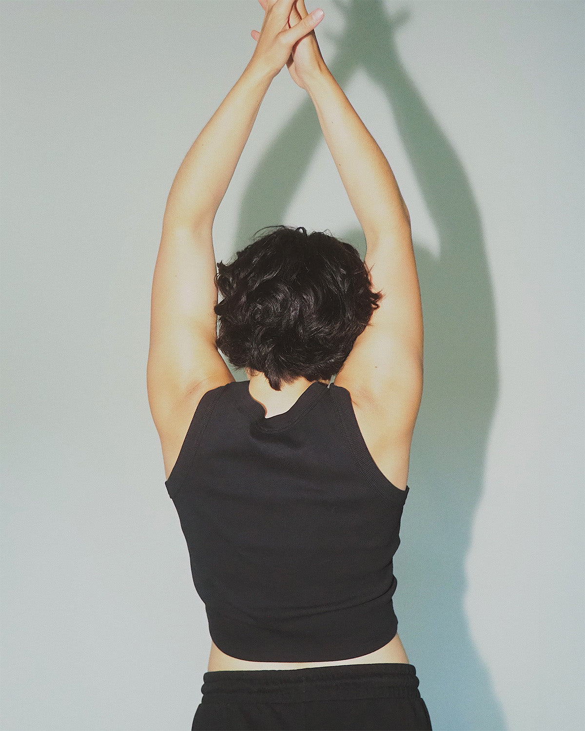 Premium women’s sustainable cotton cropped workout tank.