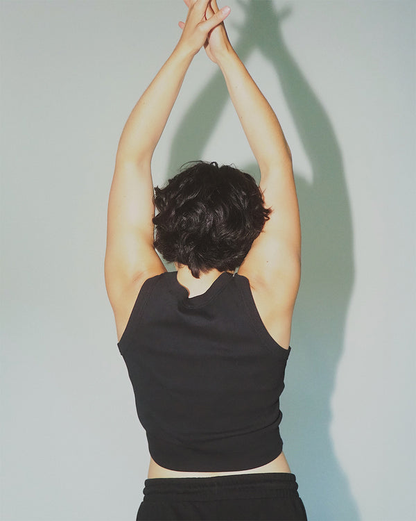 Premium women’s sustainable cotton cropped workout tank.