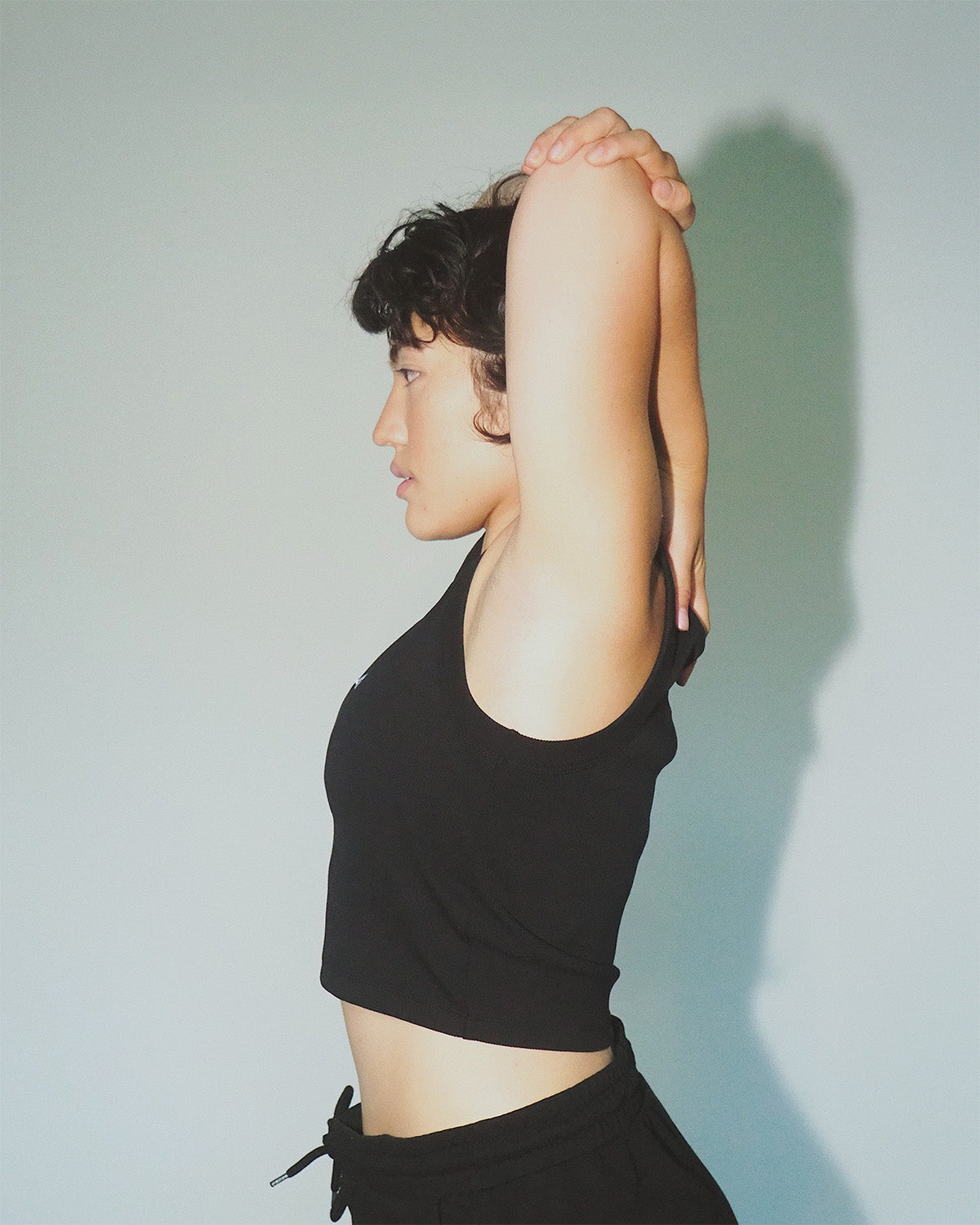 Women’s cropped organic cotton tank top, breathable fit.