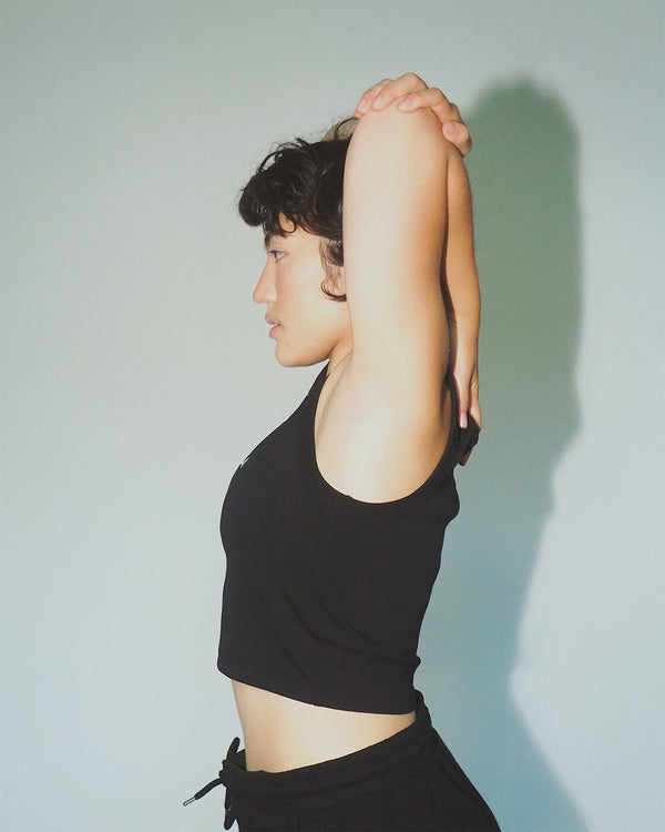 Women’s cropped organic cotton tank top, breathable fit.